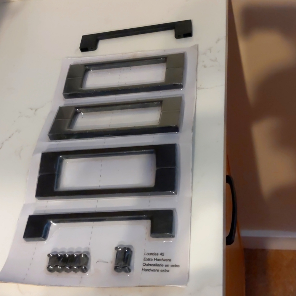 Cabinet handles with hardware. 8 total. Size is 6 1/2".